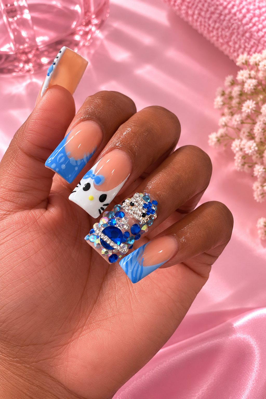 Custom hello kitty nail design created at O.P. Nails